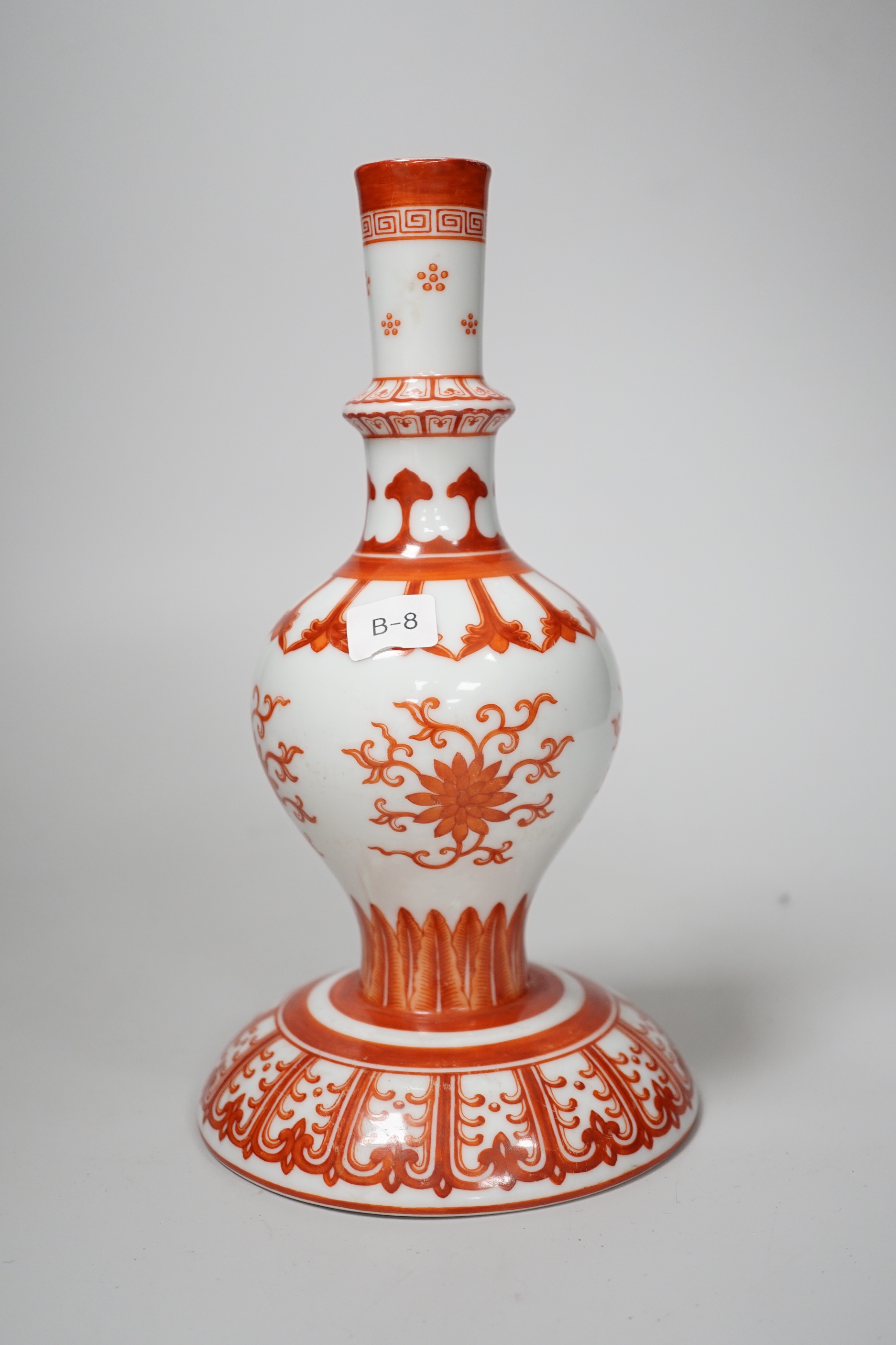 A Chinese candlestick hand painted with flowers with fitted case, 23cm high